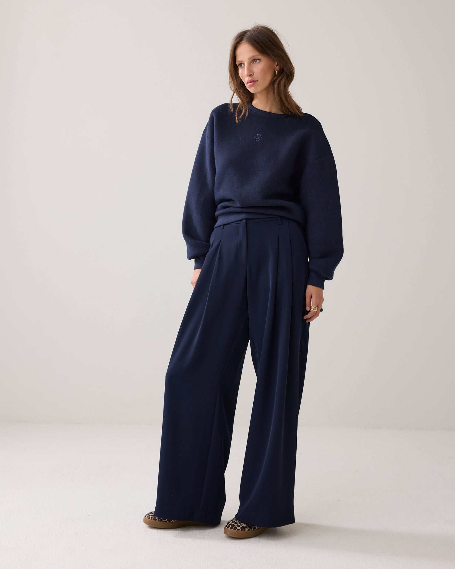 Wide trousers with double pleats