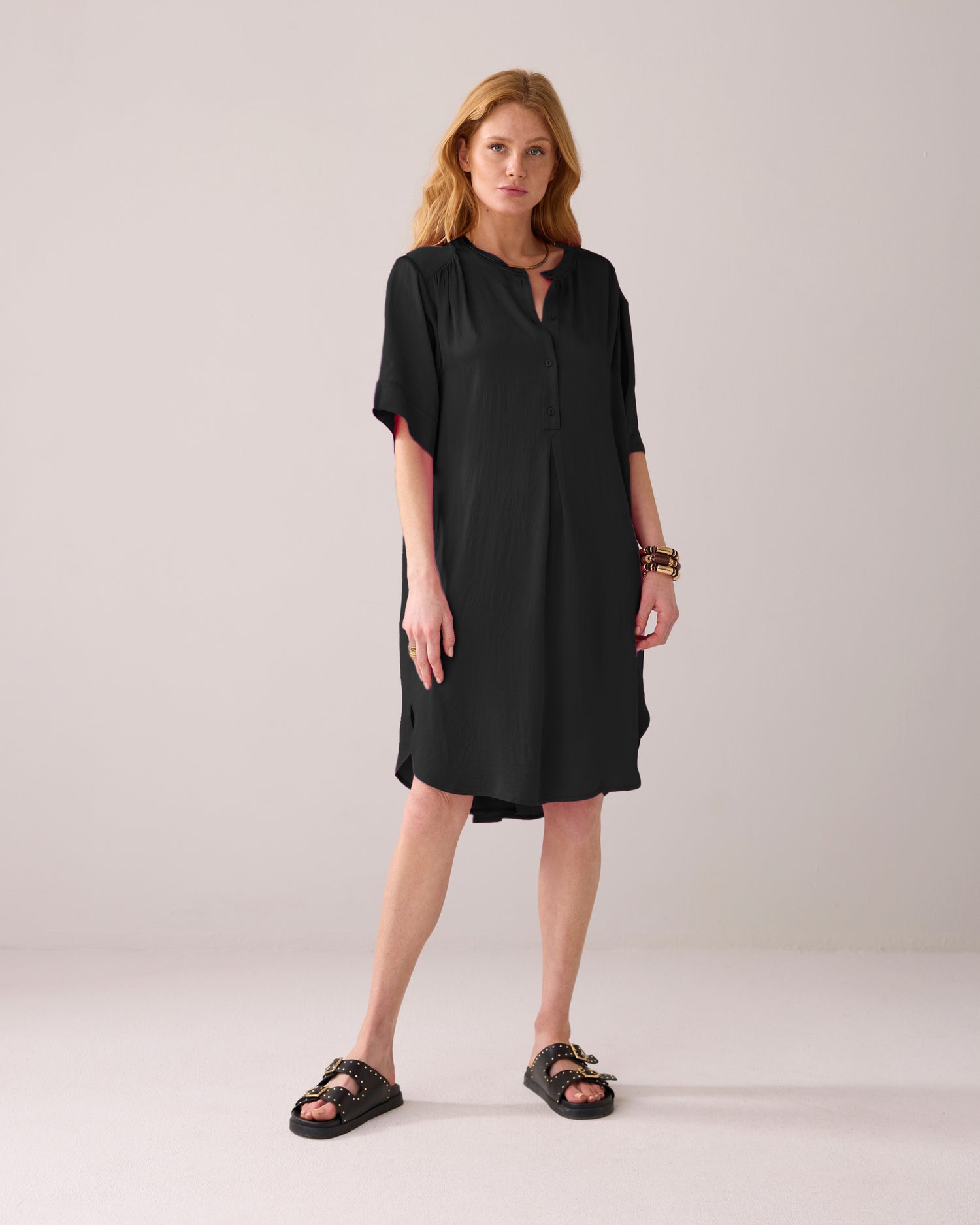 Tunic dress with button fastening