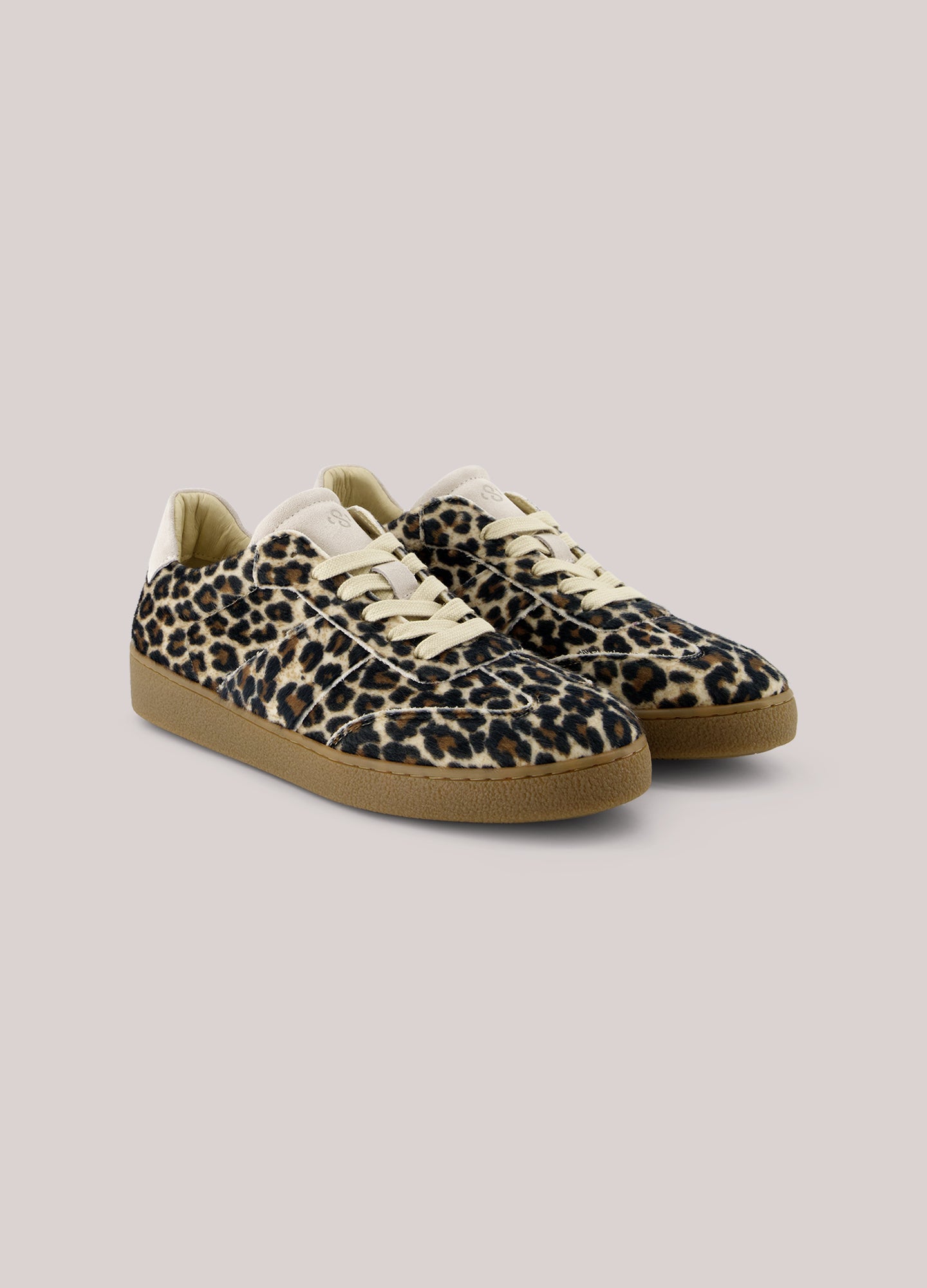 These trainers feature a synthetic upper with hairy animal print. The trainers have a rubber sole and leather lining.