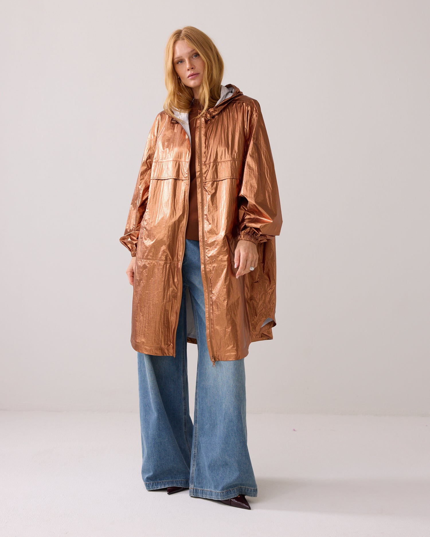 Metallic mackintosh with storage bag