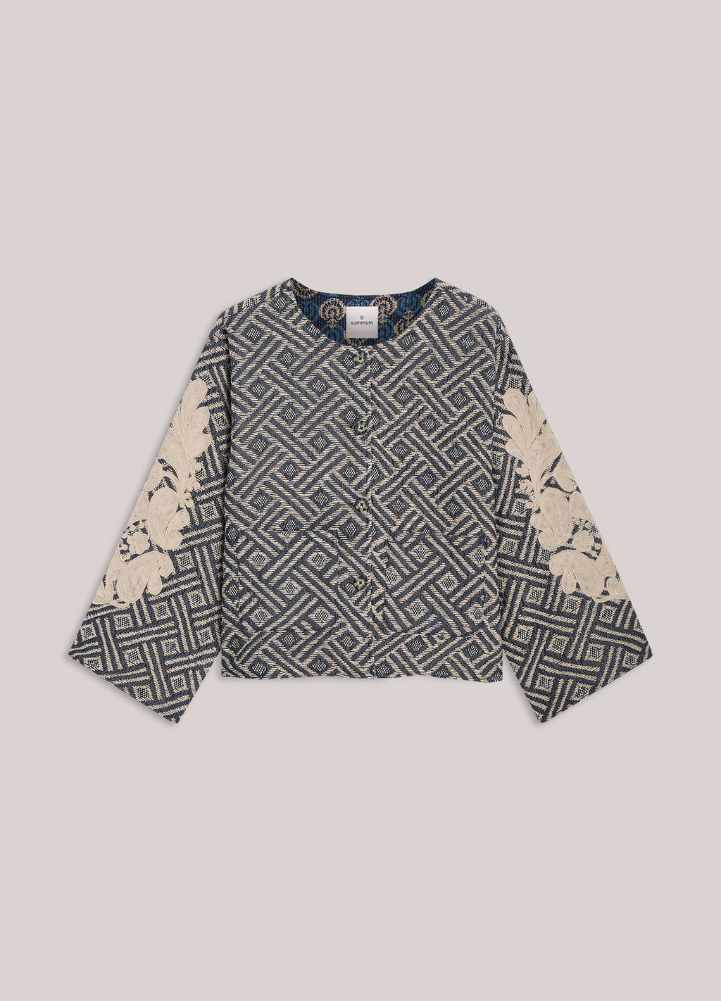 Reversible jacket with embroidery