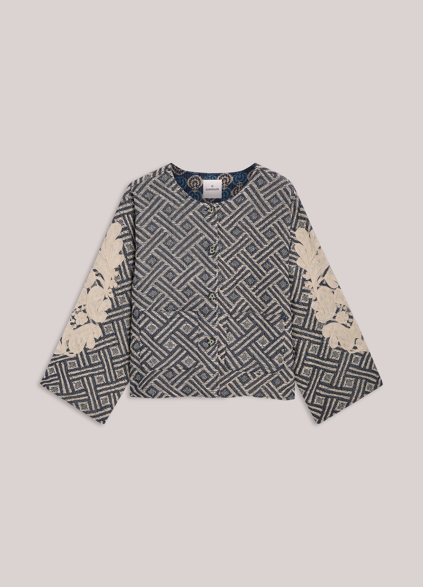 Reversible jacket with embroidery