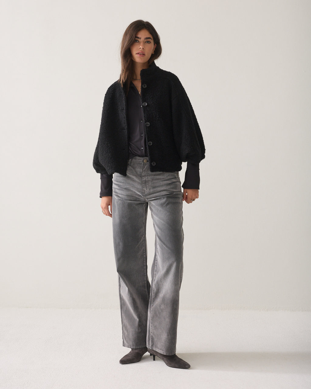 Veste cape en laine bouclée