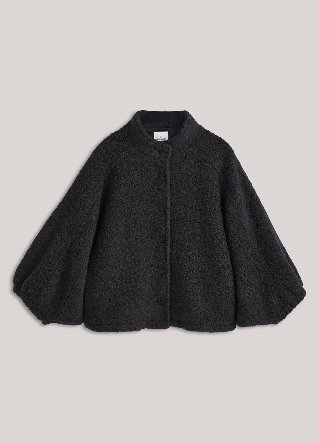 Veste cape en laine bouclée