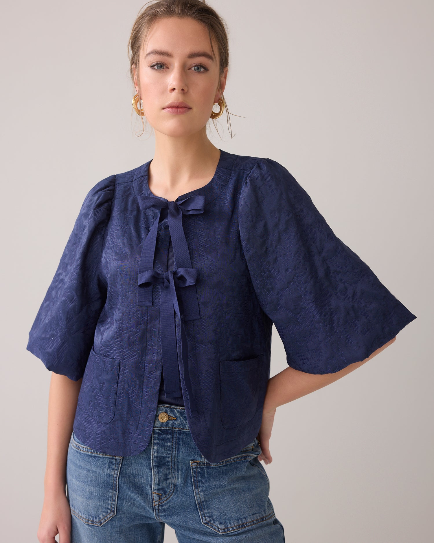 Blouse jacket with bow fastening