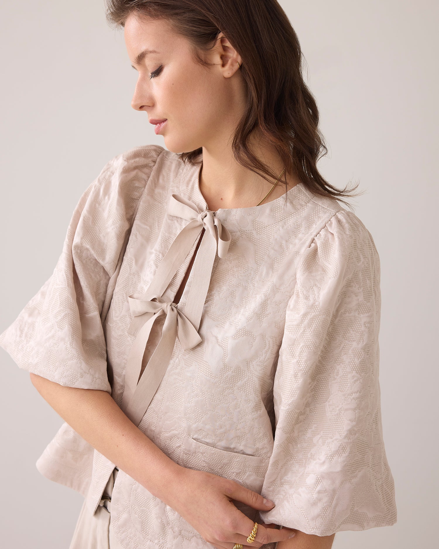 Blouse jacket with bow fastening