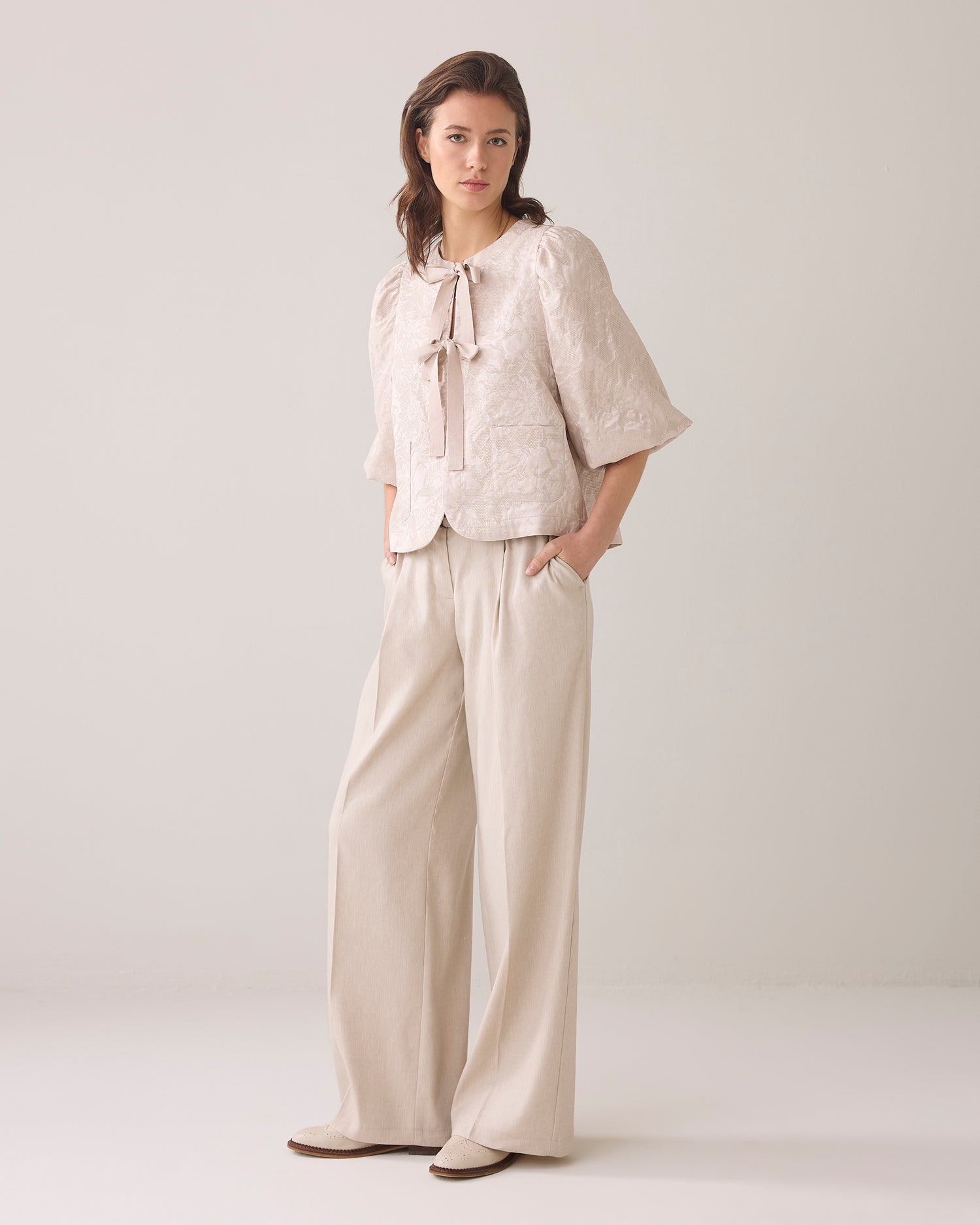 Blouse jacket with bow fastening