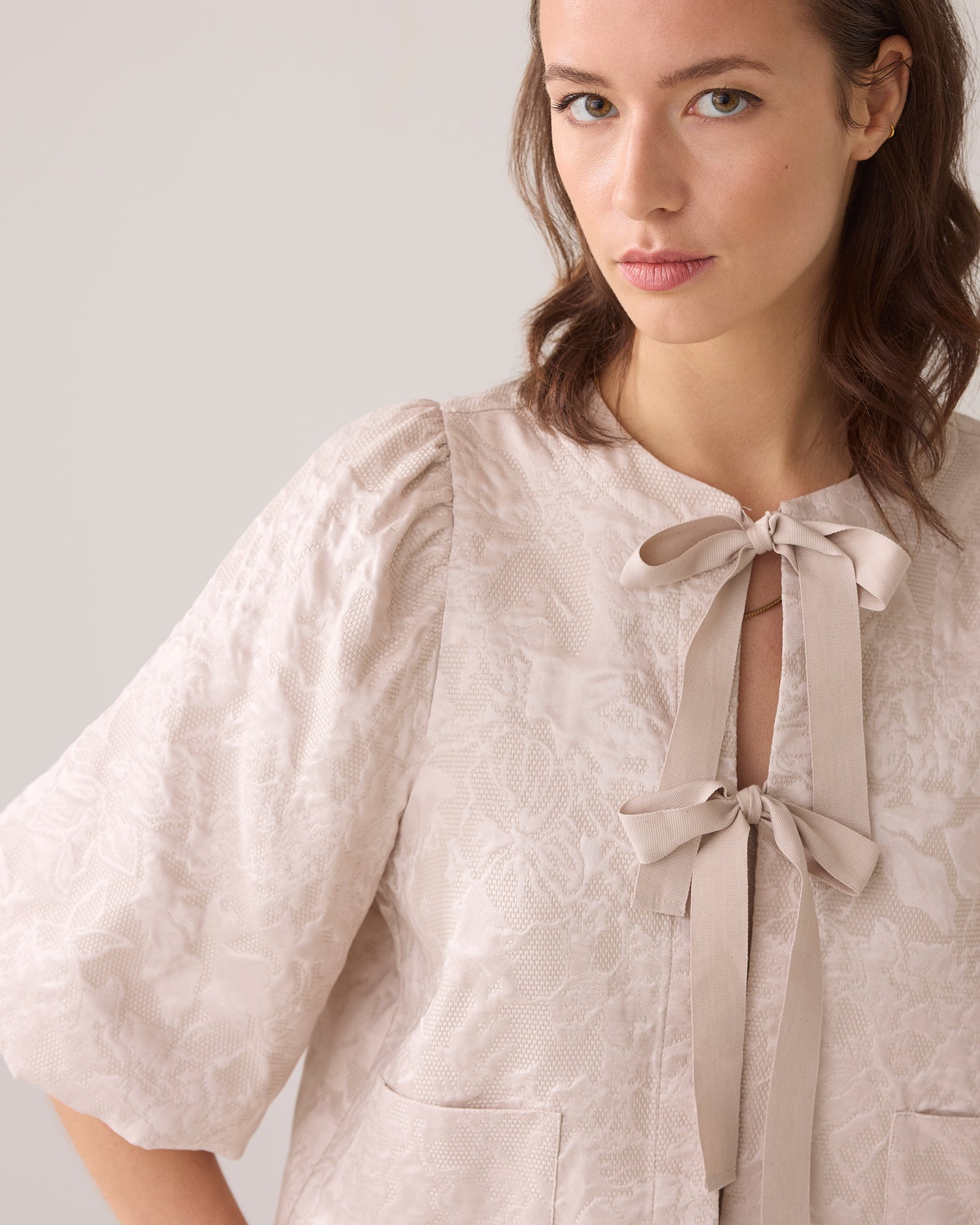 Blouse jacket with bow fastening
