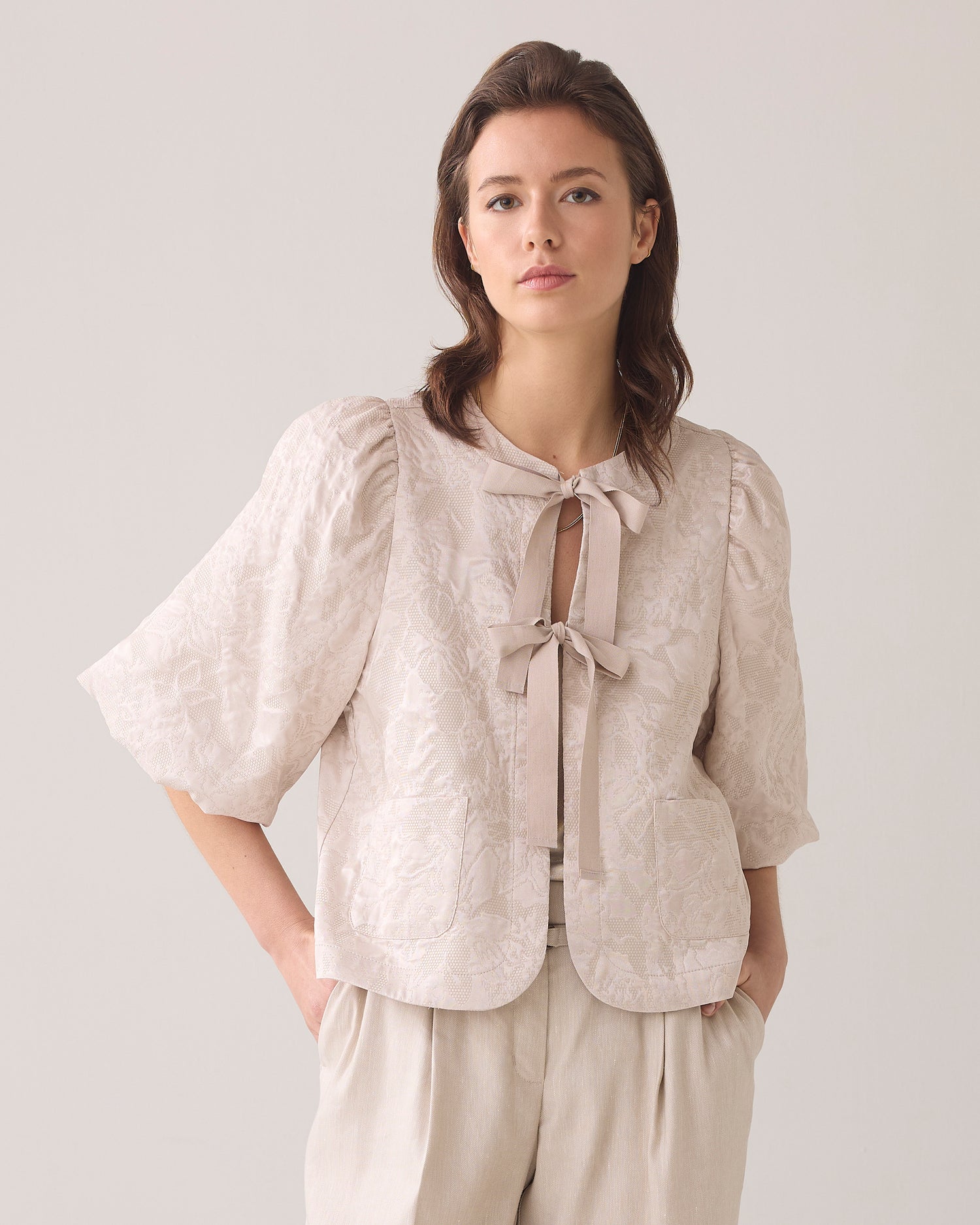 Blouse jacket with bow fastening