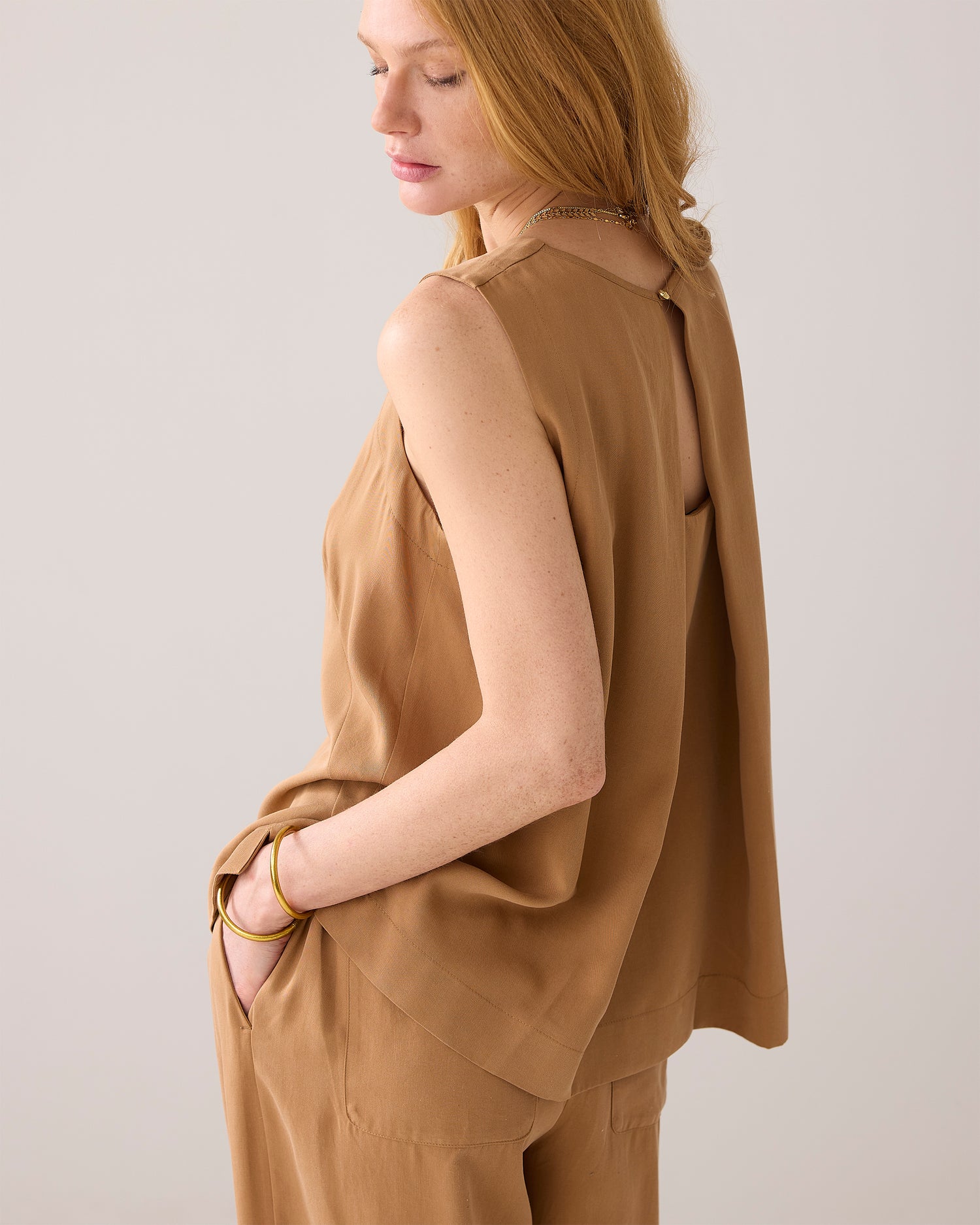 Sleeveless top with pleated detail
