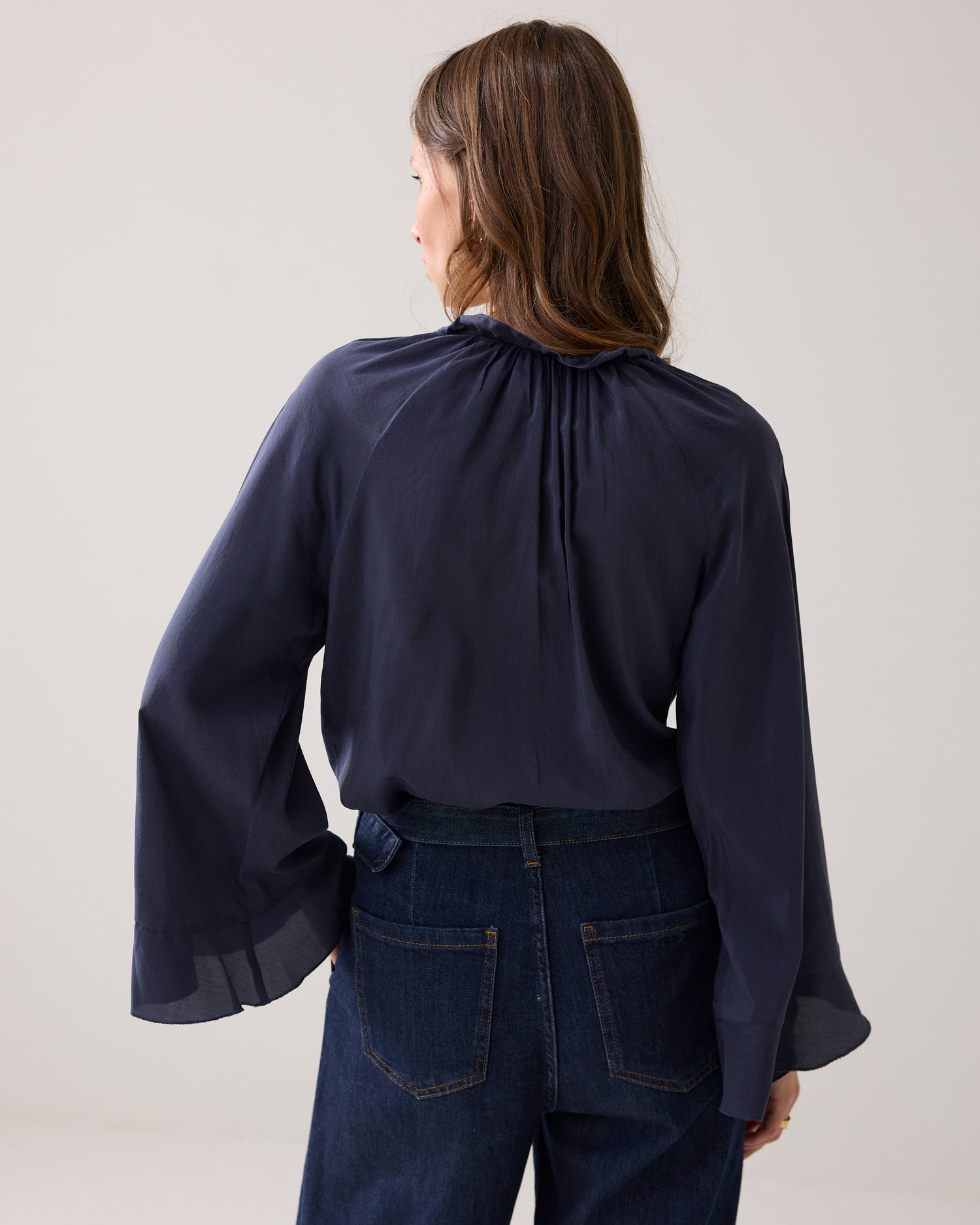 Shiny top with ruffles