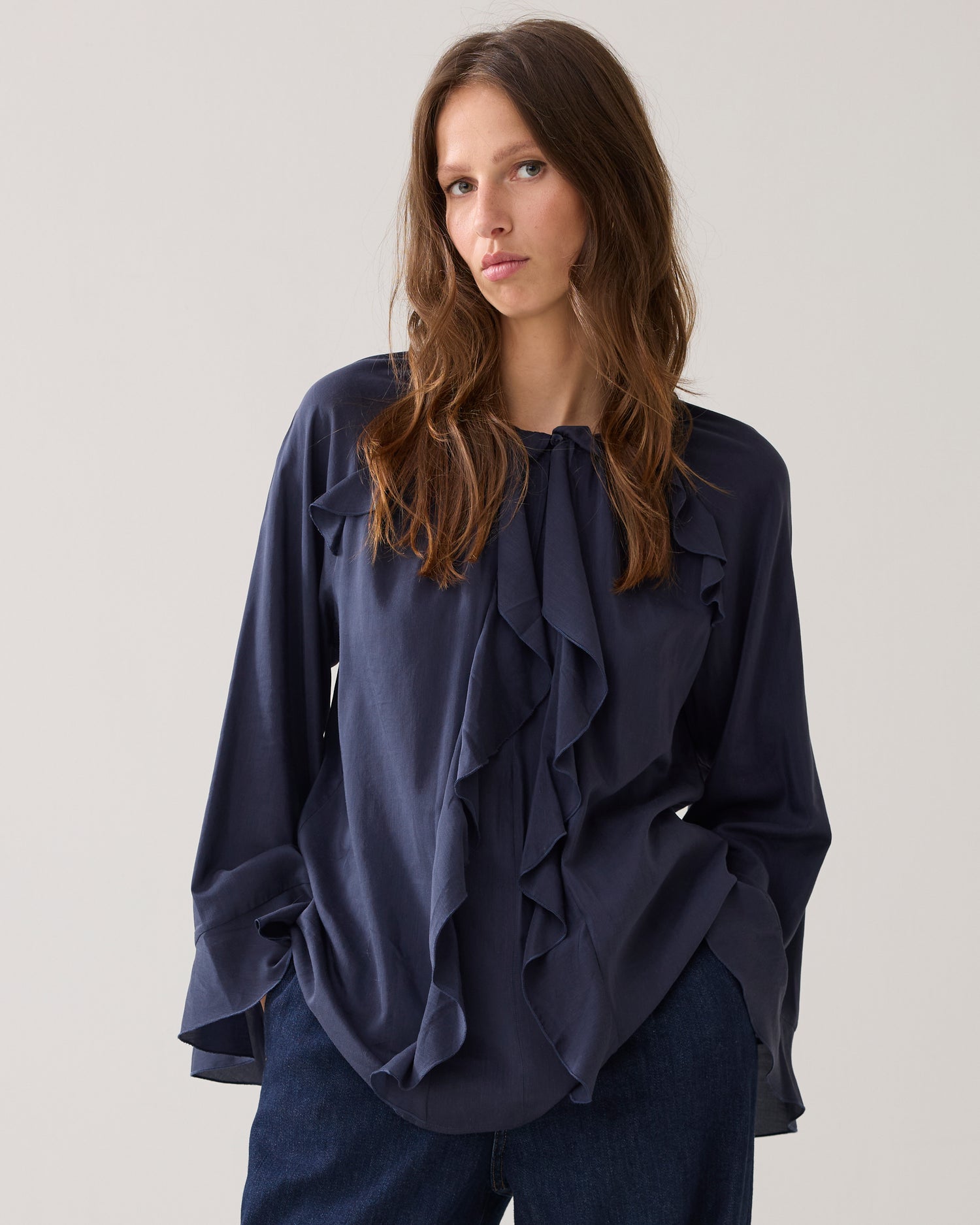 Shiny top with ruffles