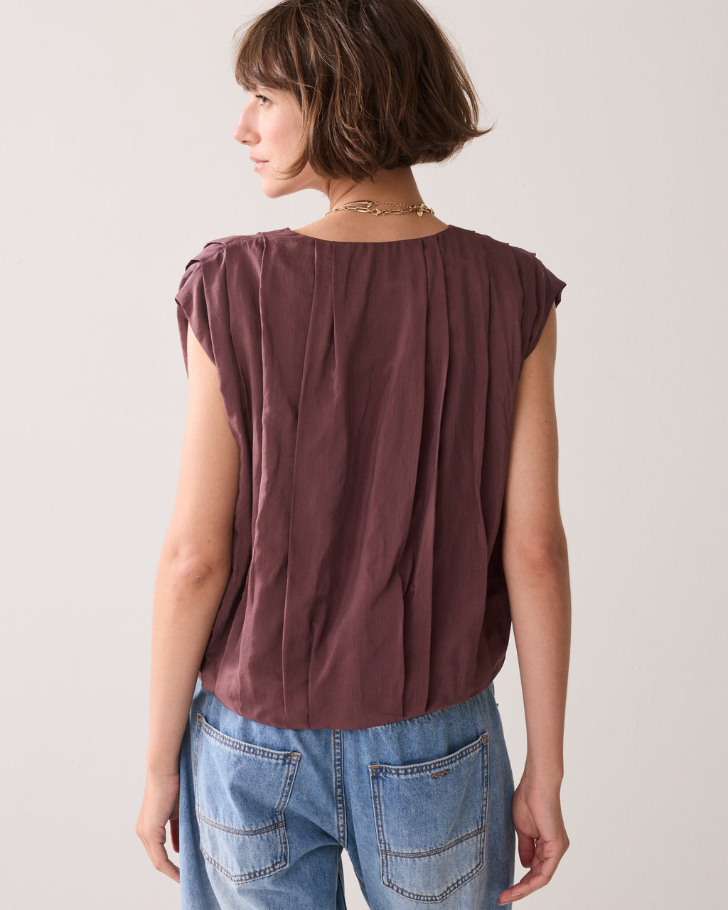 Pleated blouse with sheen