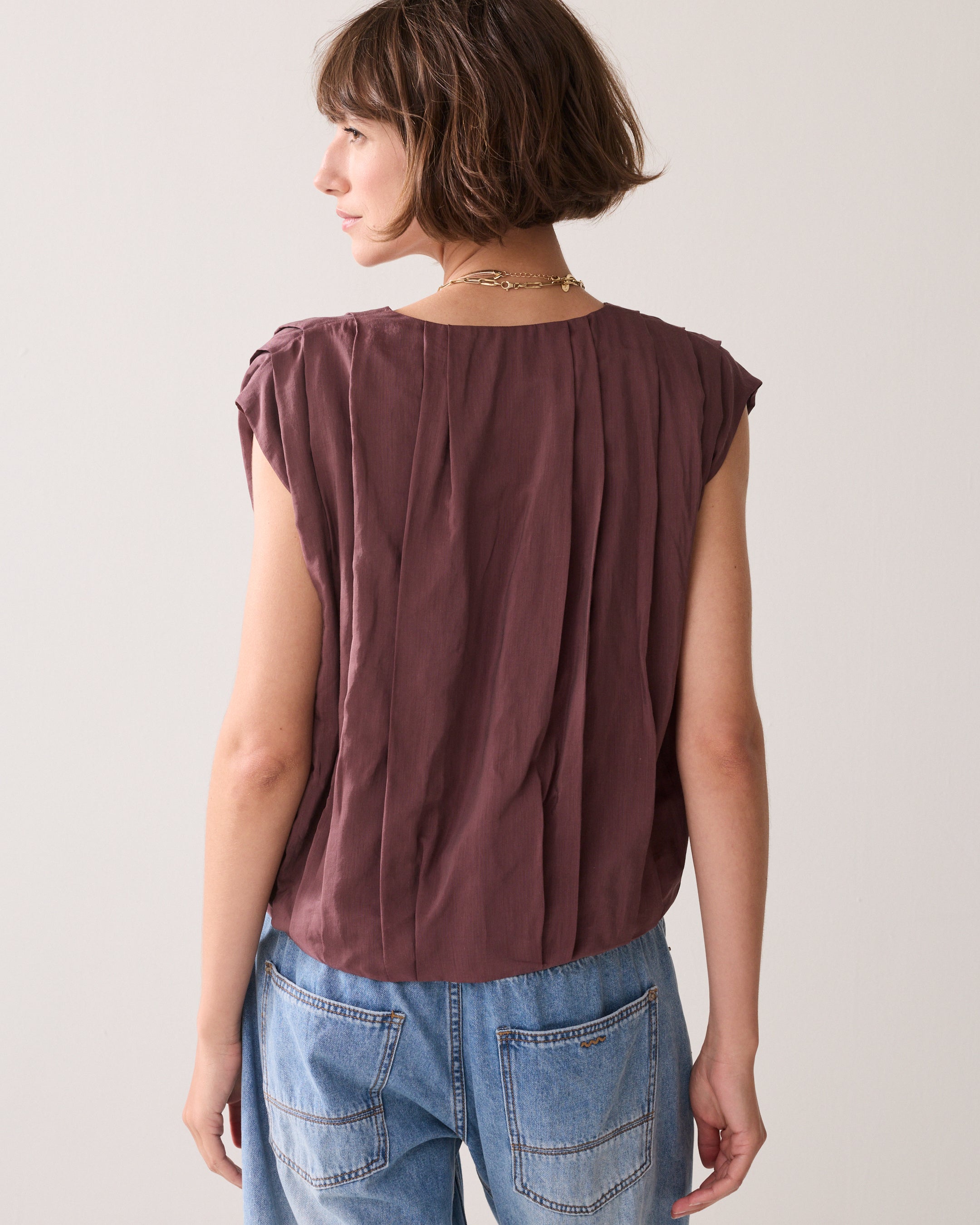 Pleated blouse with sheen