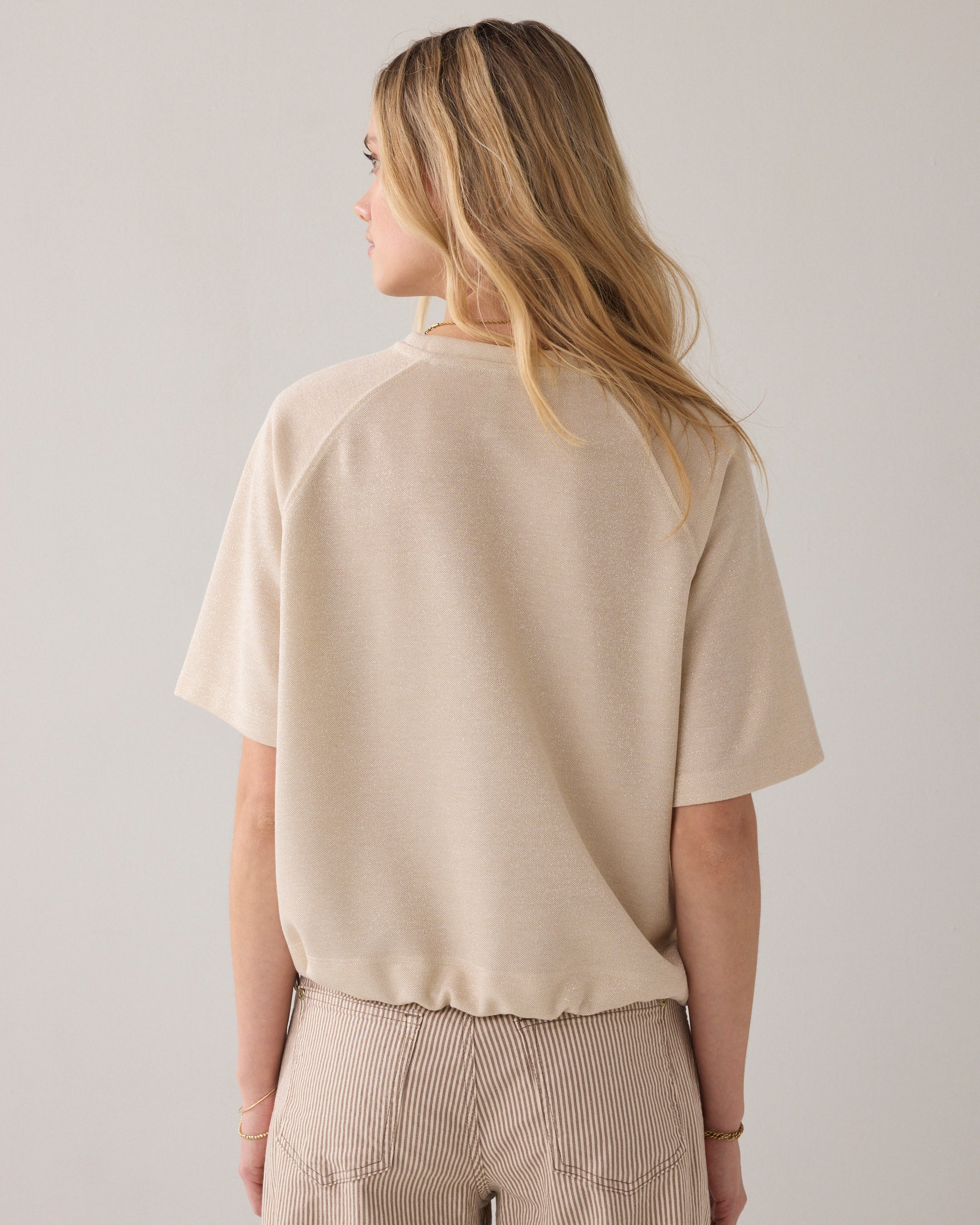 Top van lurex piqué
