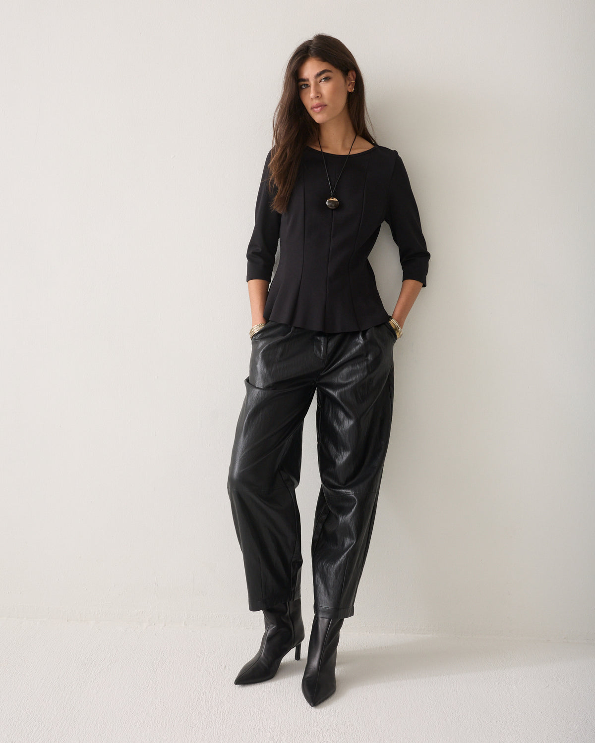 Getailleerde peplum top