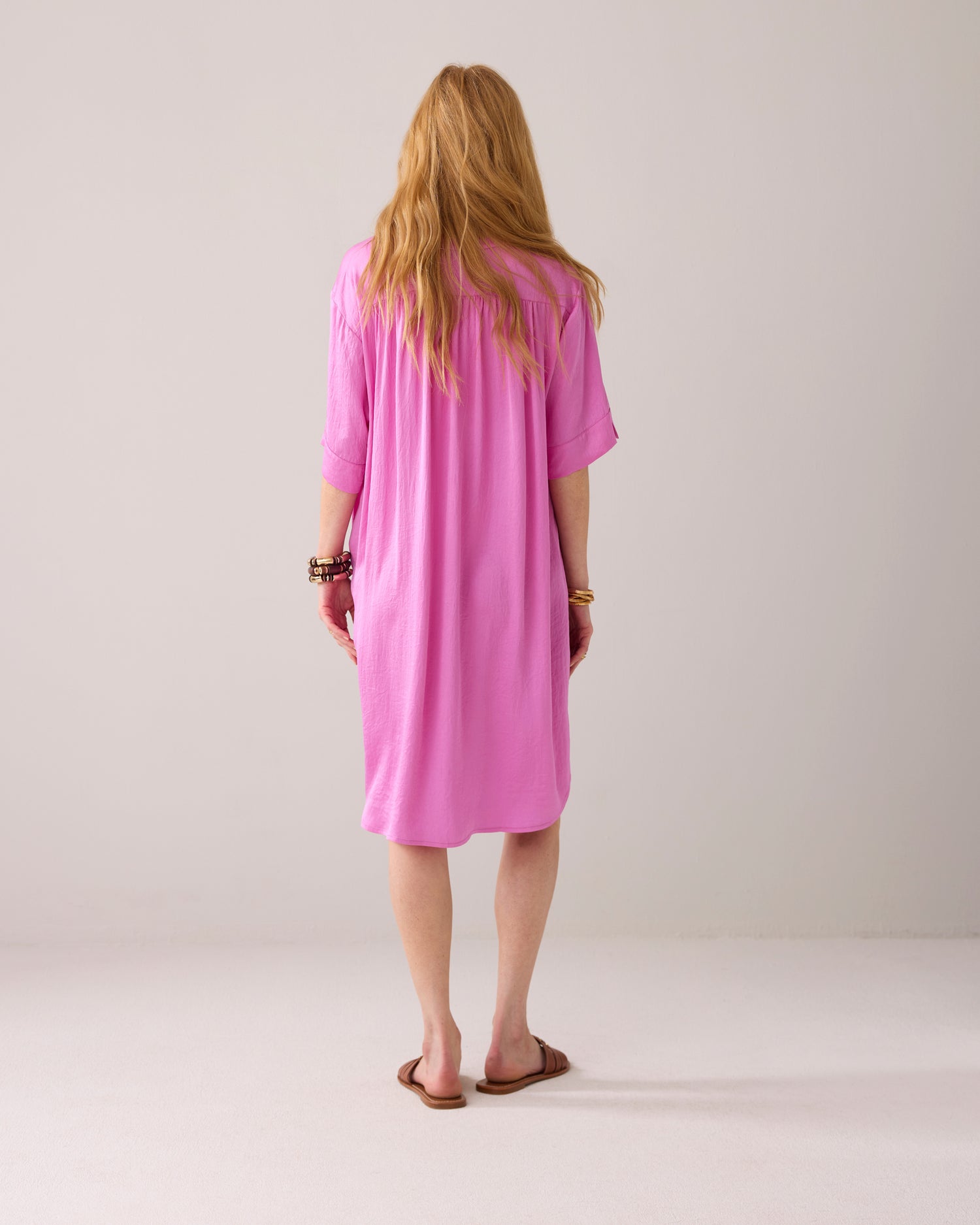 Tunic dress with button fastening