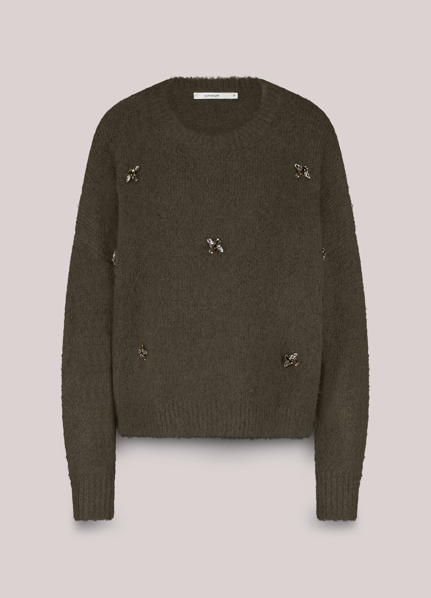 Jumper with brooches