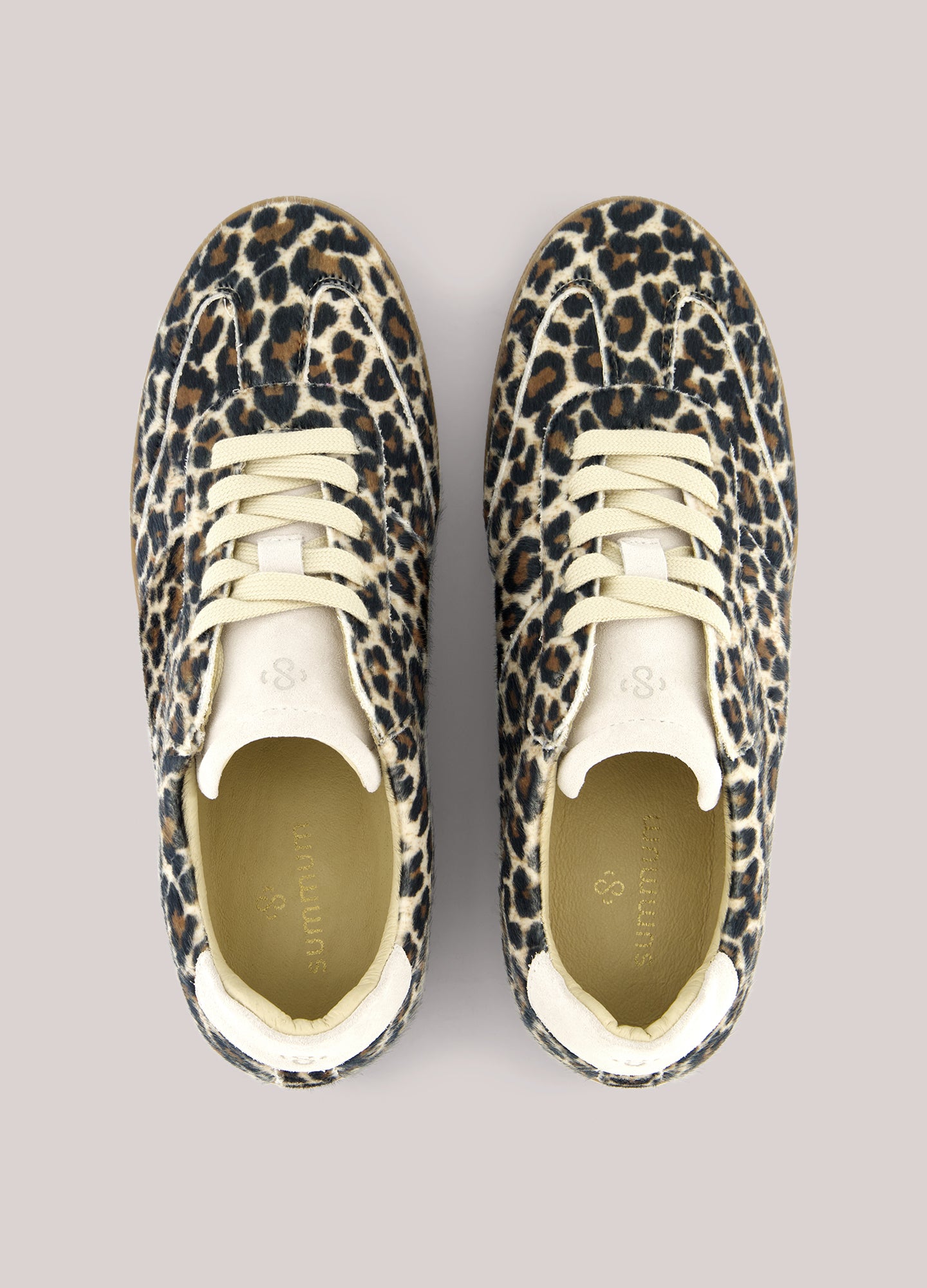 These trainers feature a synthetic upper with hairy animal print. The trainers have a rubber sole and leather lining.